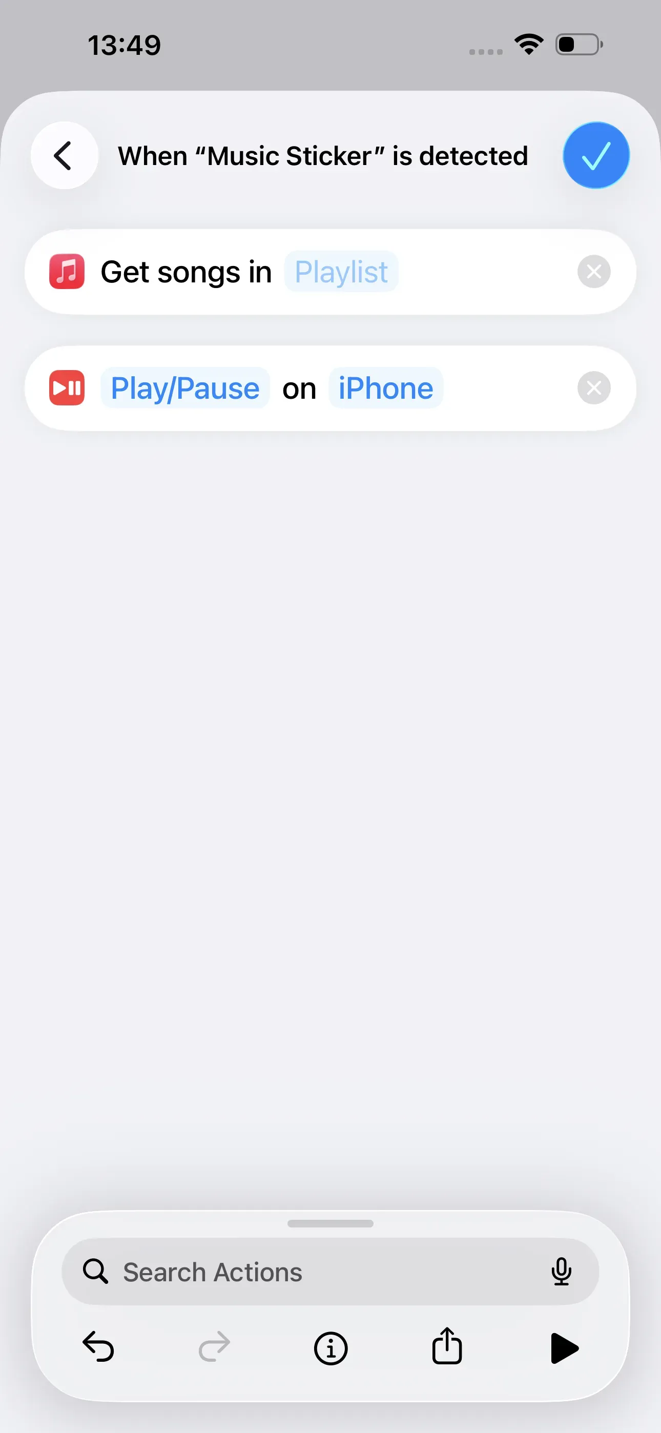 The “Get songs in Playlist” and “Play/Pause on iPhone” actions have been selected.
